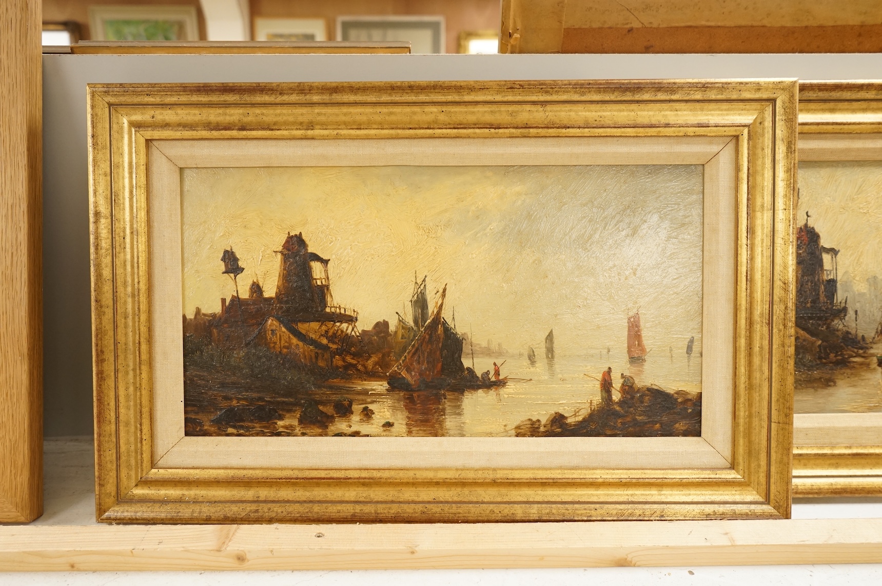 19th century, Dutch School, Riverscapes with windmills and boats, unsigned, pair of oils on board, 20 x 39cm